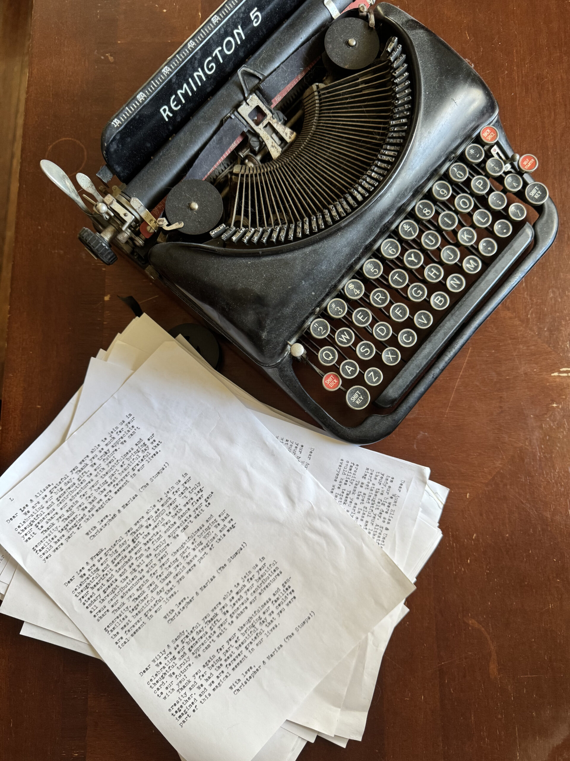A 1930s Remington 5 Typewriter next to half written thank you notes (evidence of the dreaded thank you note task mentioned in the blog post)
